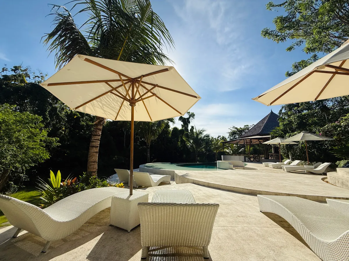 Infinity pool and tropical greenery at Tregge Surf Camp Uluwatu